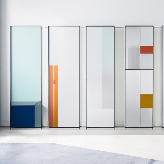 A minimalist, modern storage unit with sleek metal frames, adorned with colorful, abstract art pieces on its doors, set against a clean, white background with subtle shadows and soft, natural light.